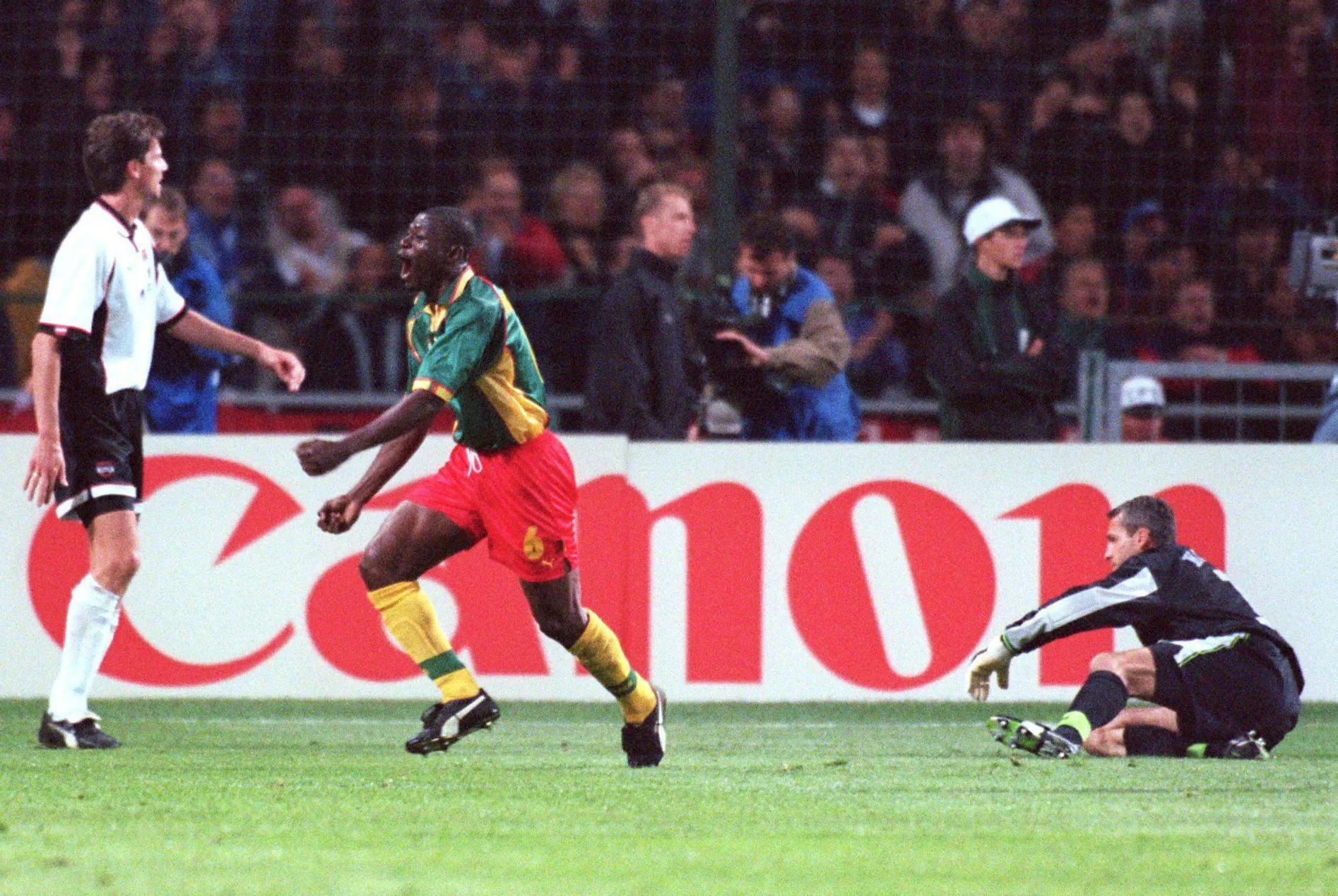 Pierre Njanka runs away in celebration after scoring for Cameroon in their World Cup 1998 group match against Austria in Toulouse.