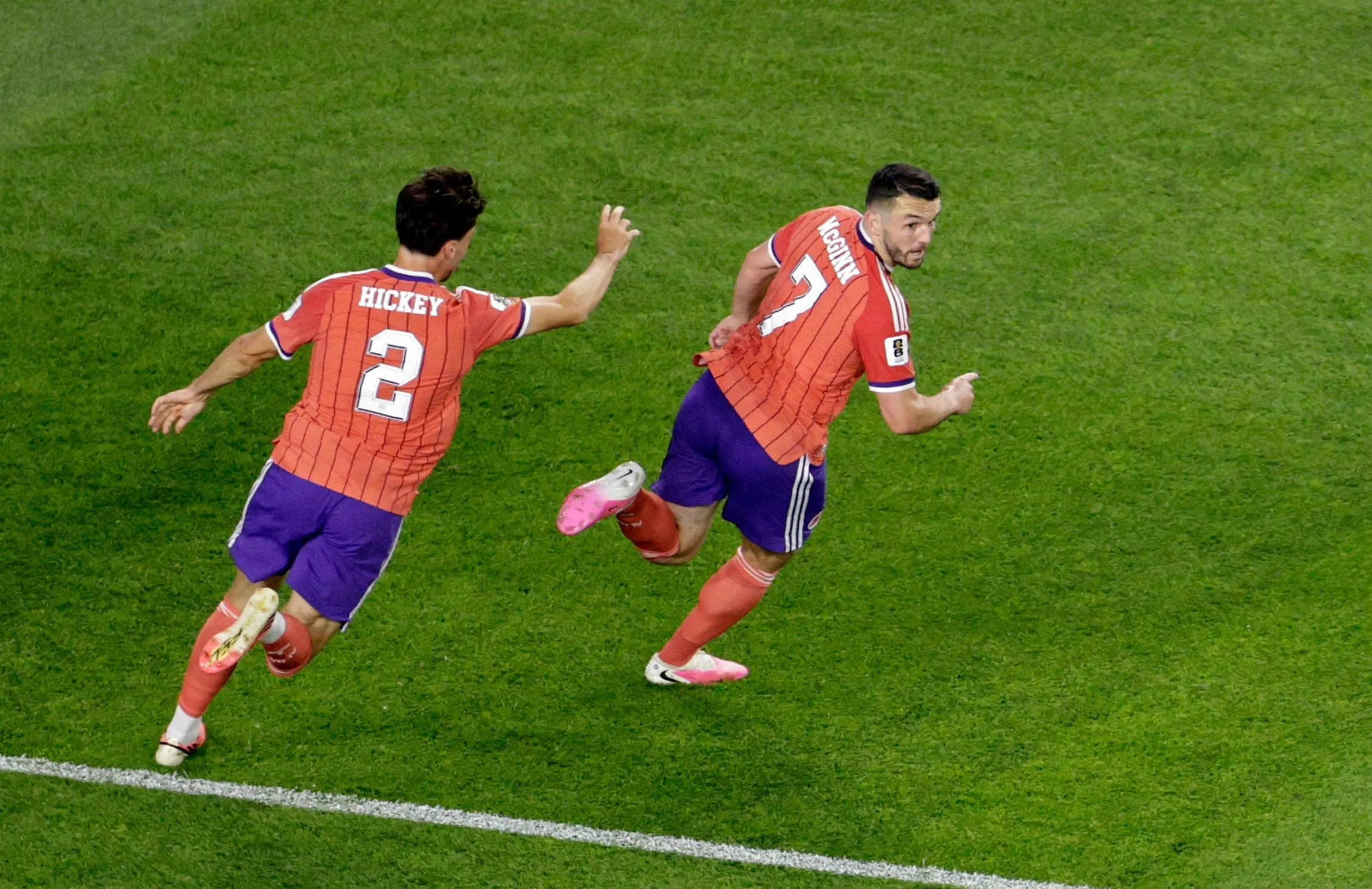 John McGinn celebrates scoring their first goal with Aaron Hickey