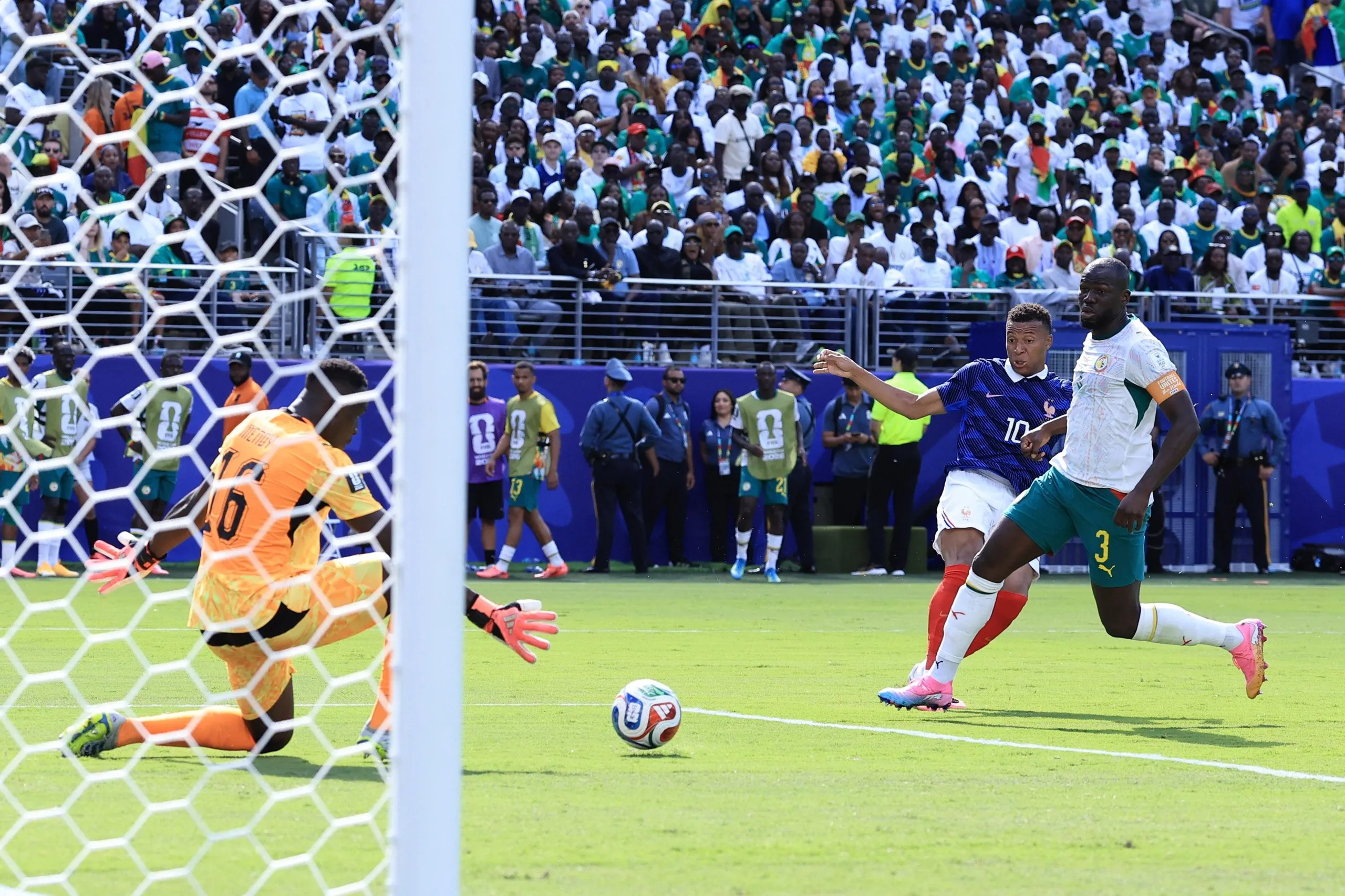 Kylian Mbappé swivels and shoots to open the scoring for France.