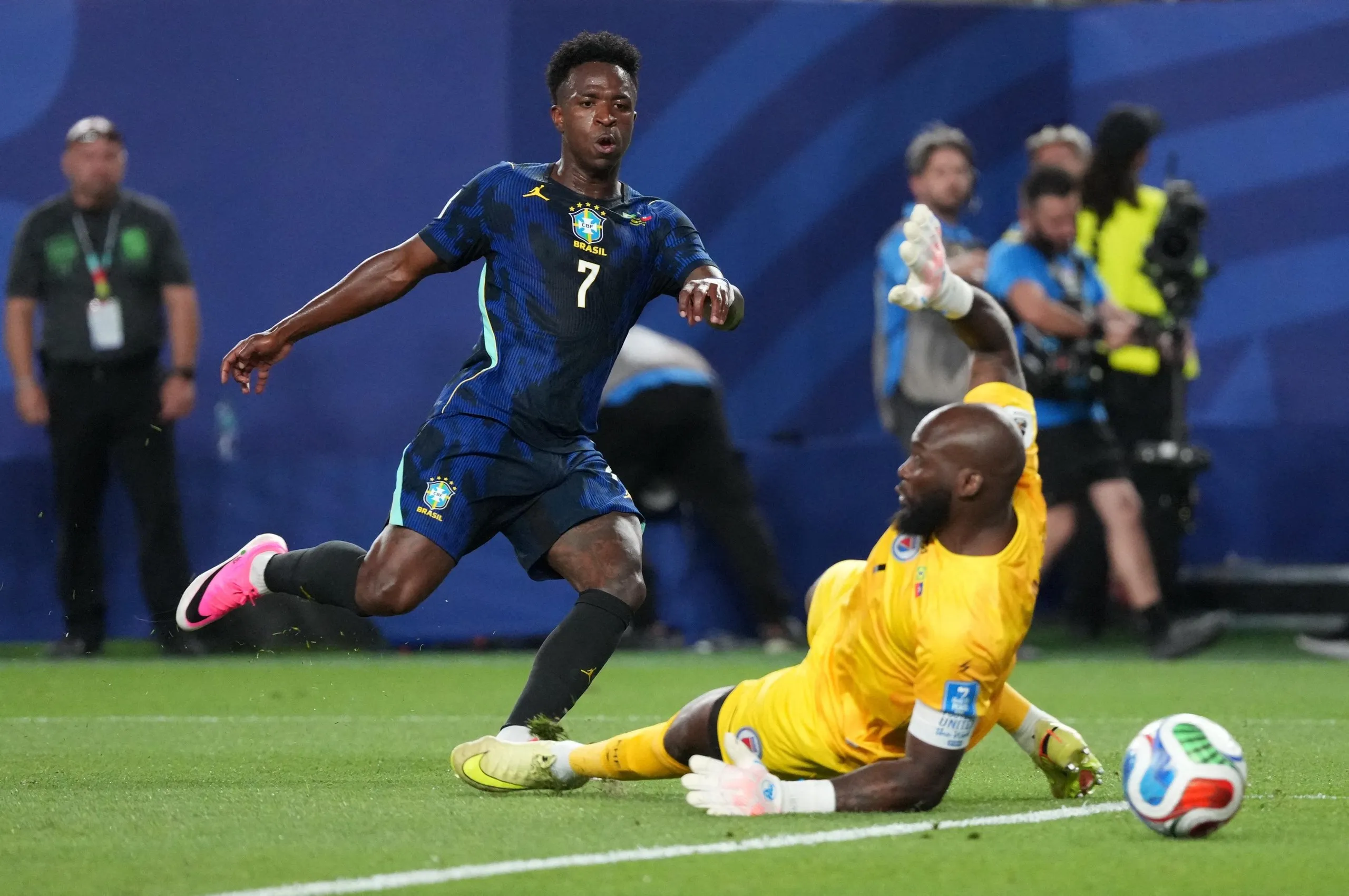 Vinicius Junior beats Johny Placide for Brazil’s third goal.