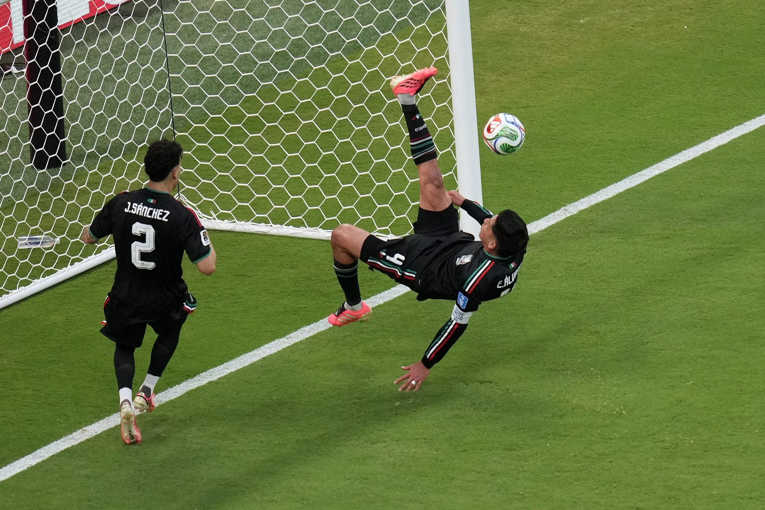 Mexico's Edson Alvarez clears with an overhead kick