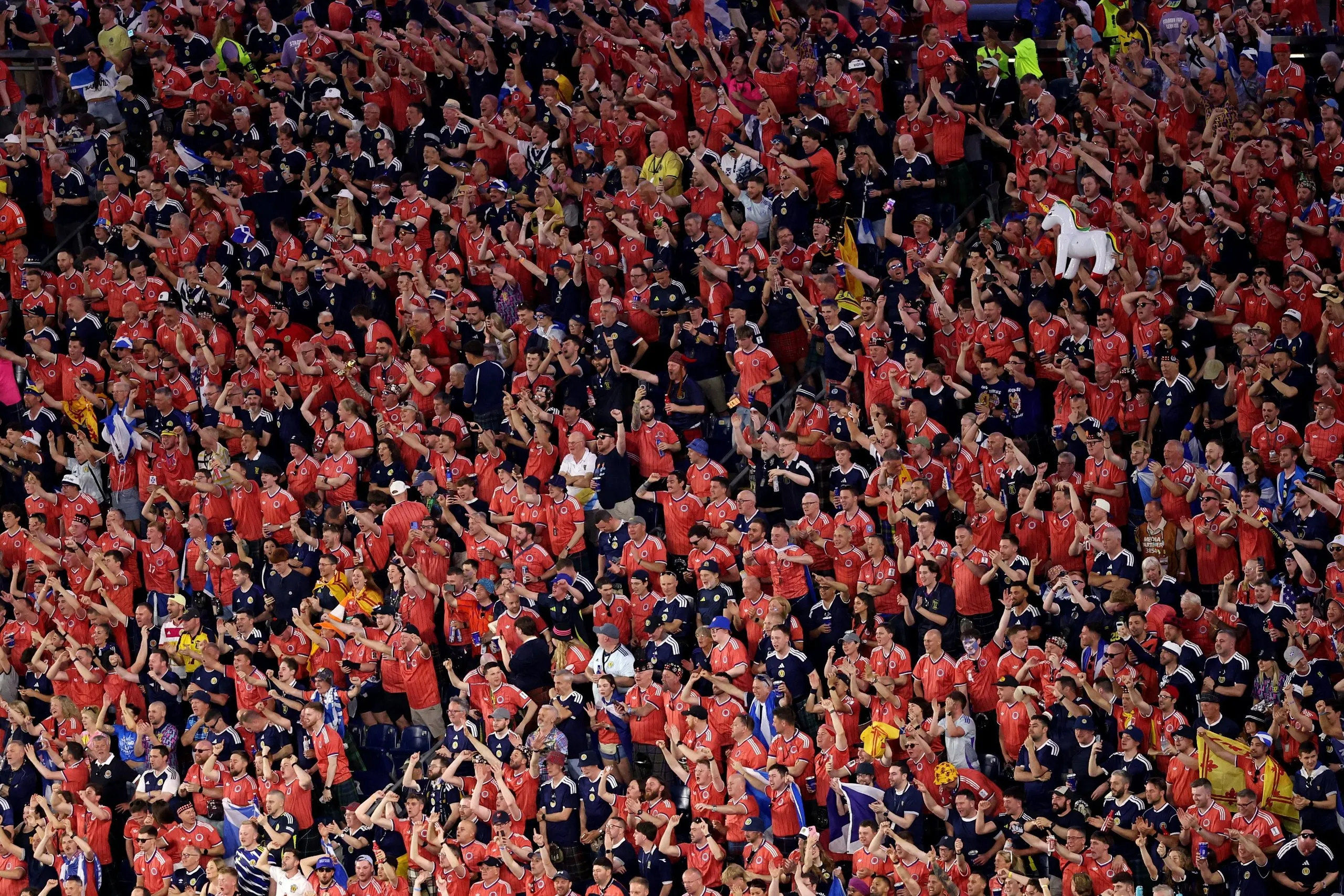 Scotland fans cheer as the players of Scotland line up for the national anthem