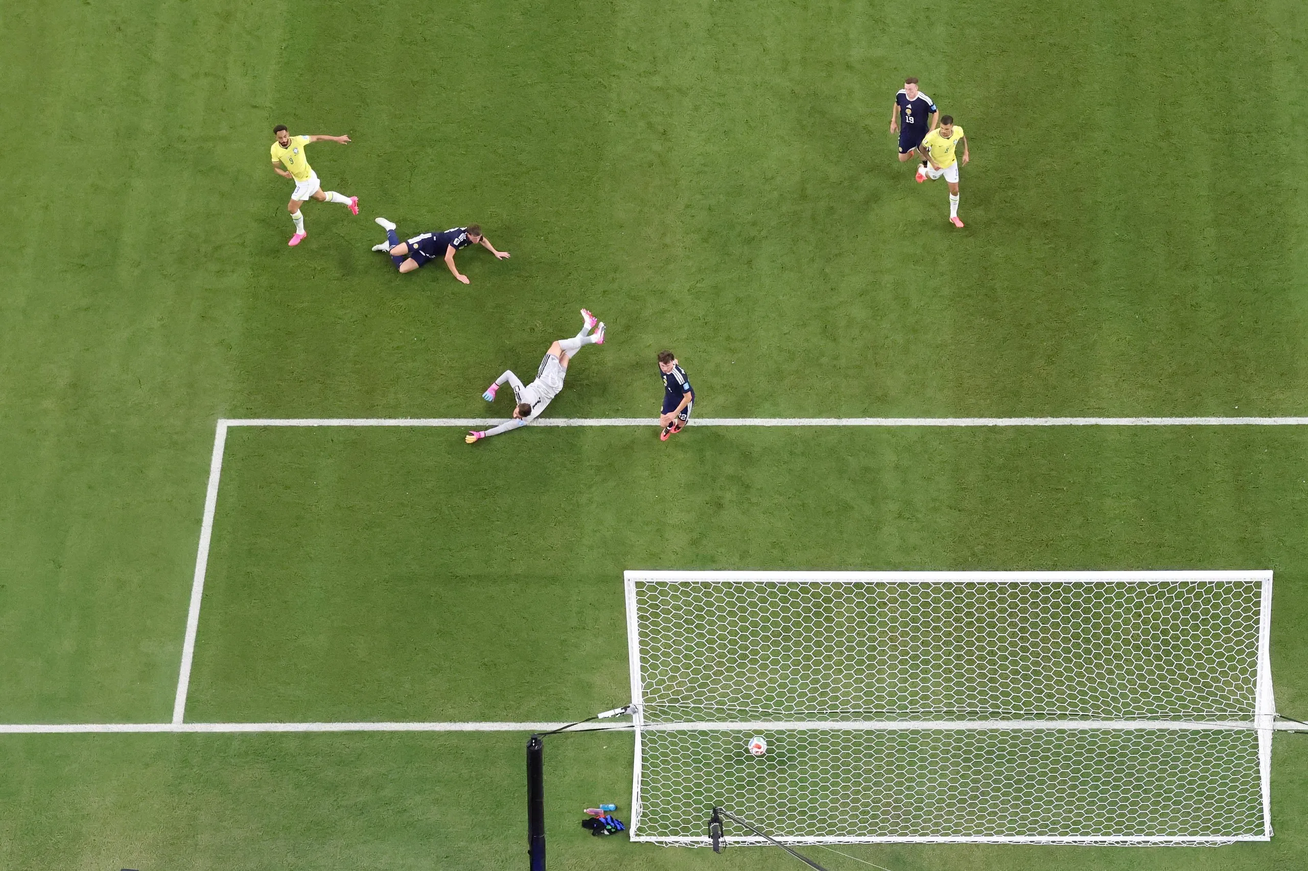 Matheus Cunha scores their third for Brazil past Angus Gunn.