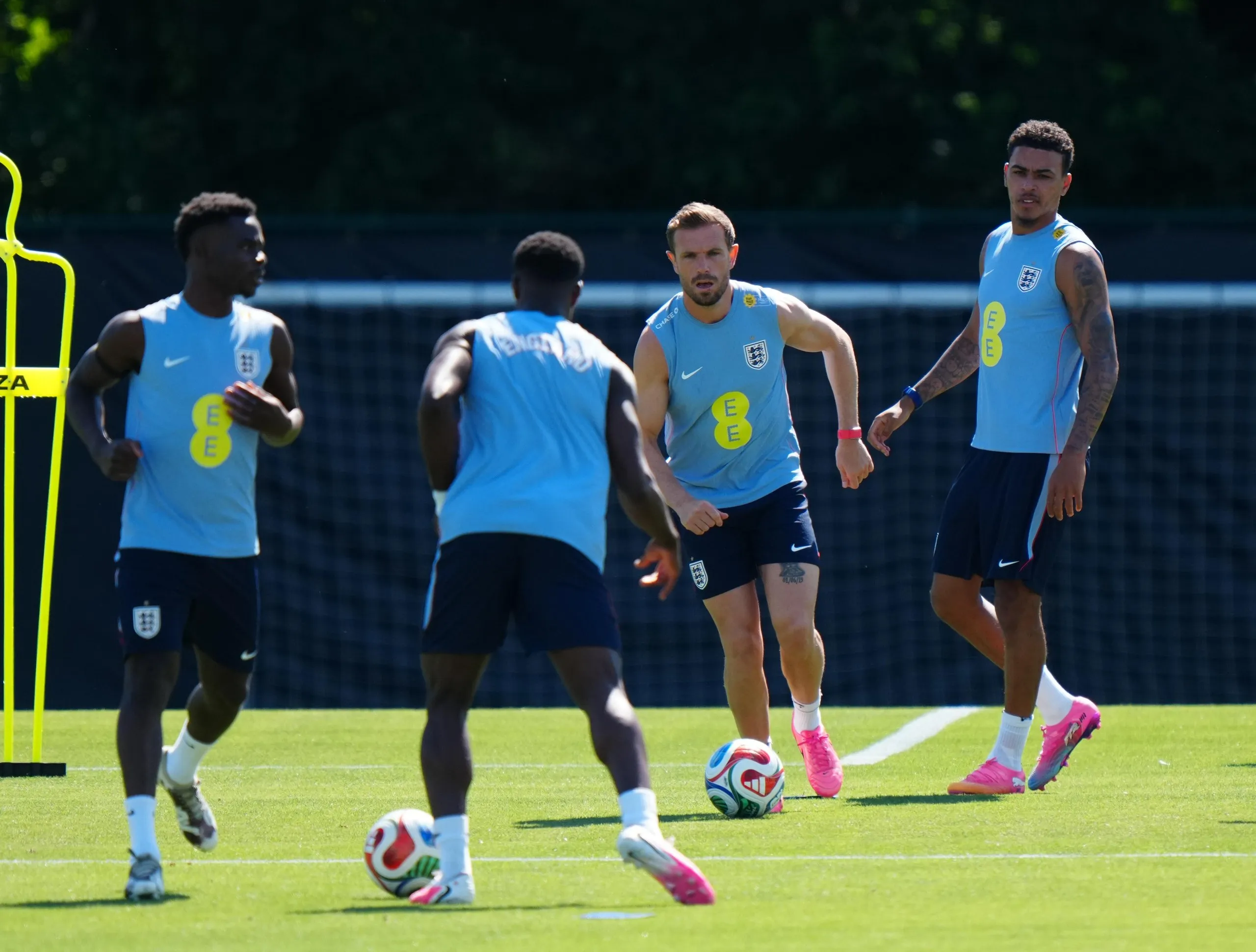 England’s Jordan Henderson runs with the ball during a training session at Swope Soccer Village, Kansas City