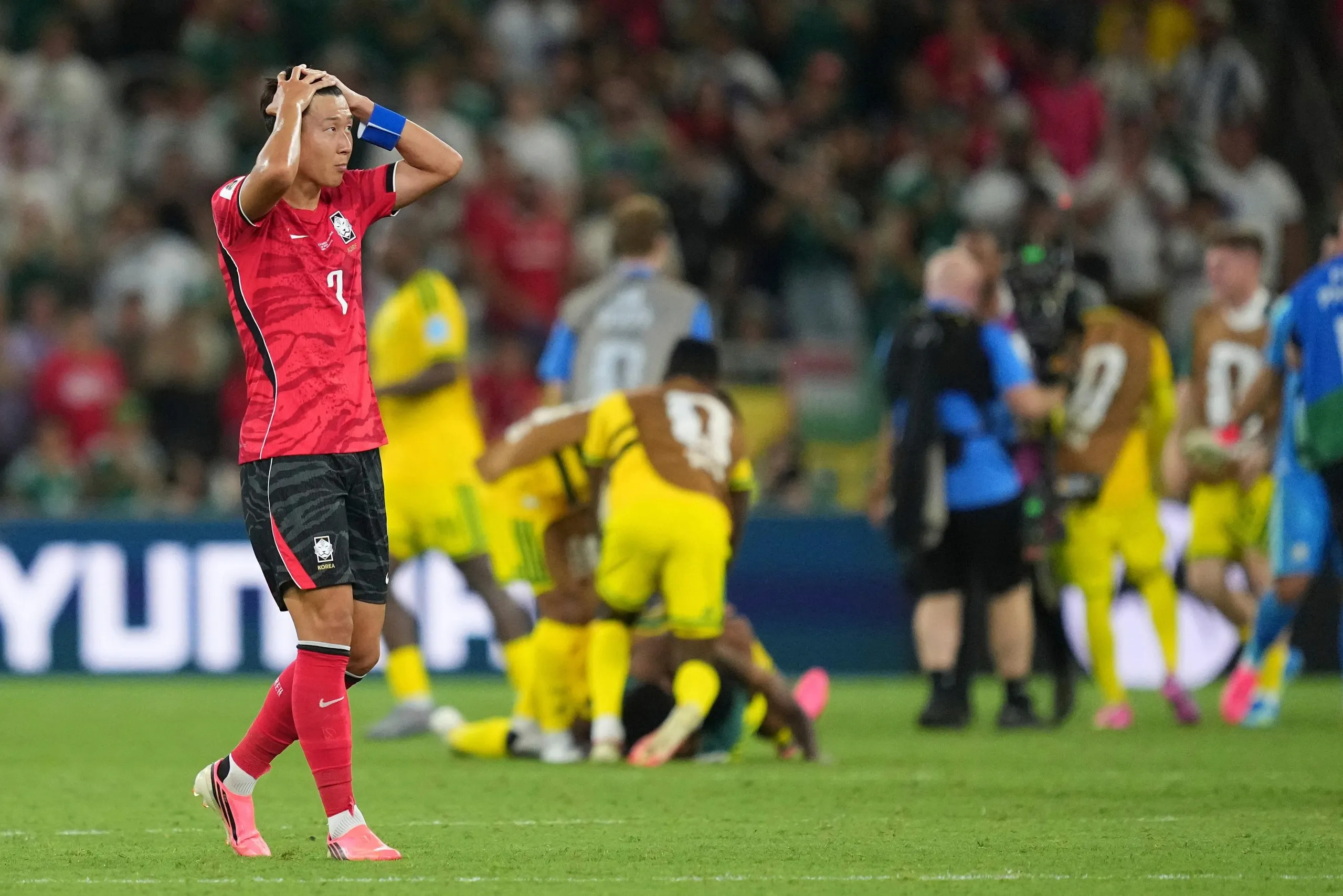 South Korea’s Son Heung-min reacts at full time as South Africa celebrate.
