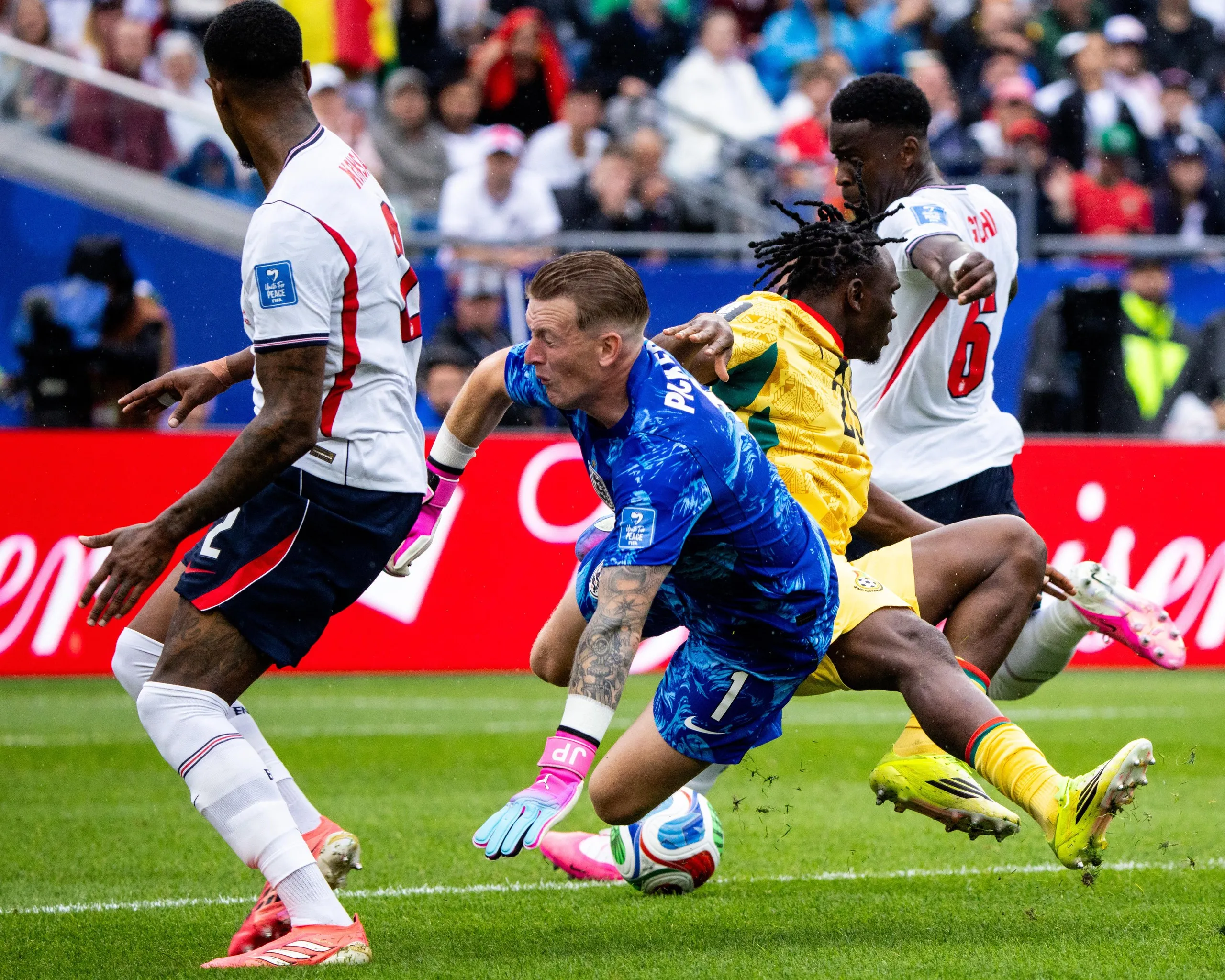 Jordan Pickford clatters into Ghana’s Prince Kwabena Adu