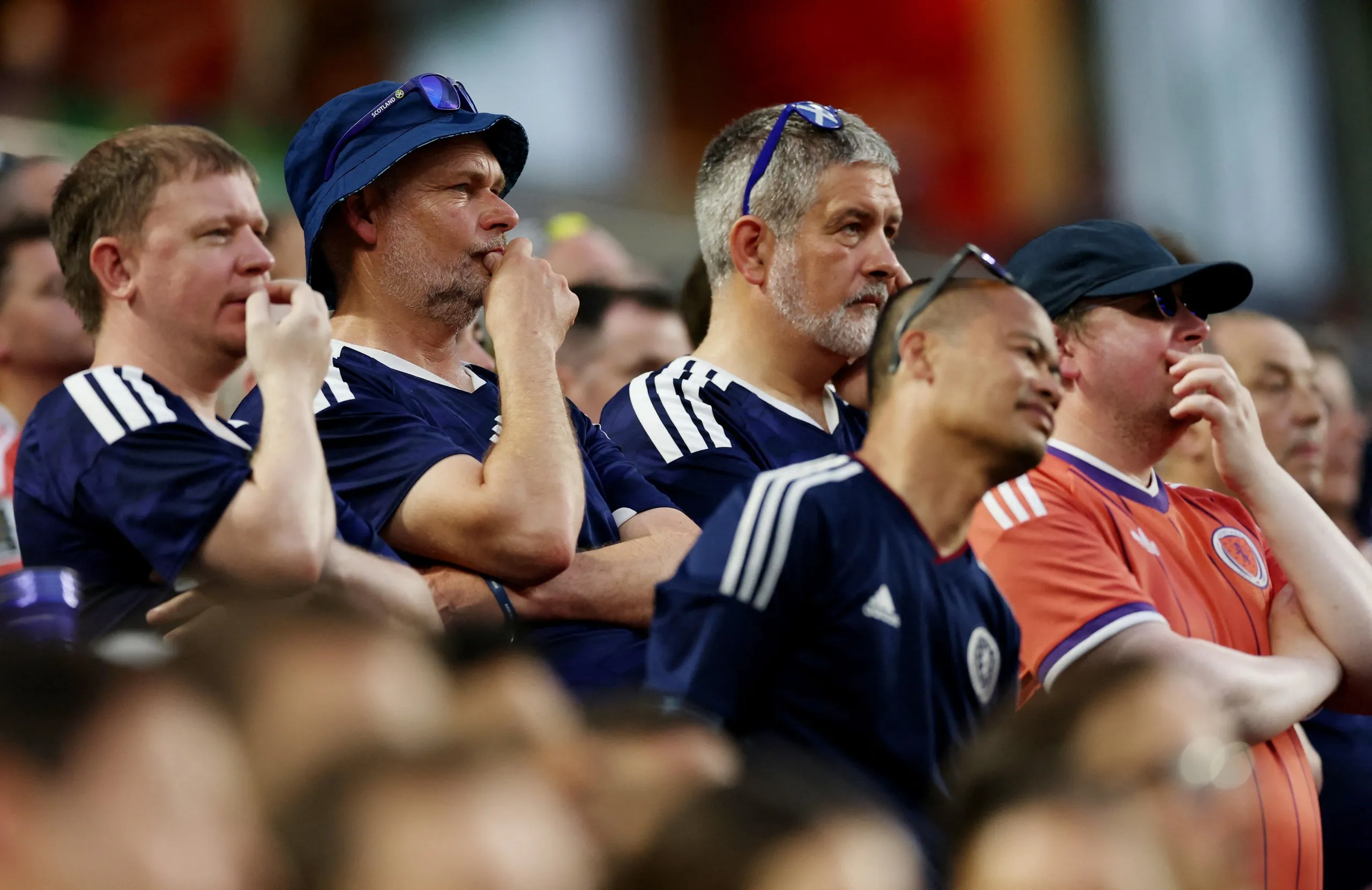 Glum-looking Scotland fans in the stands