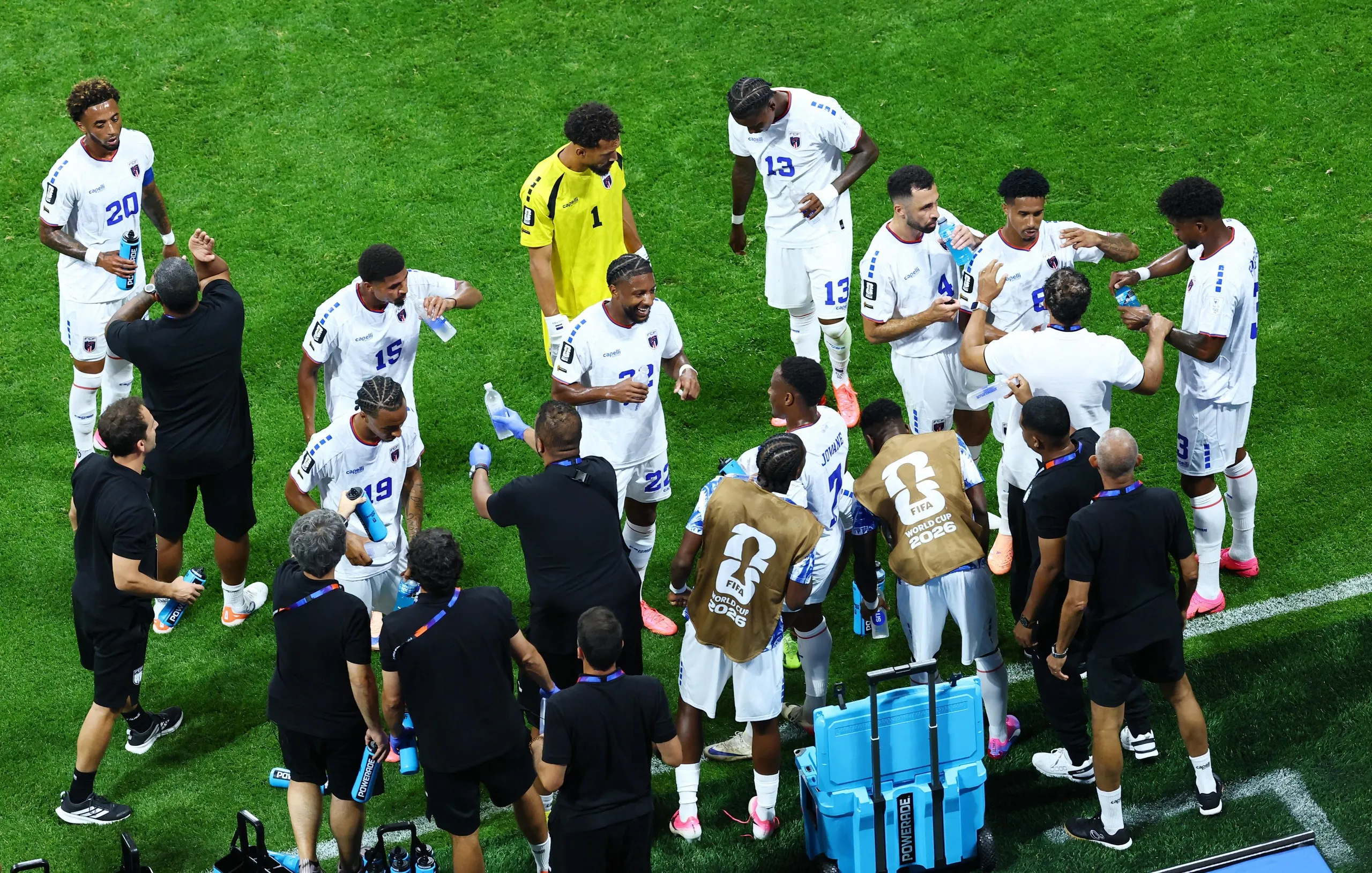 Cape Verde coach Pedro Brito gives instructions to his players during a hydration break.