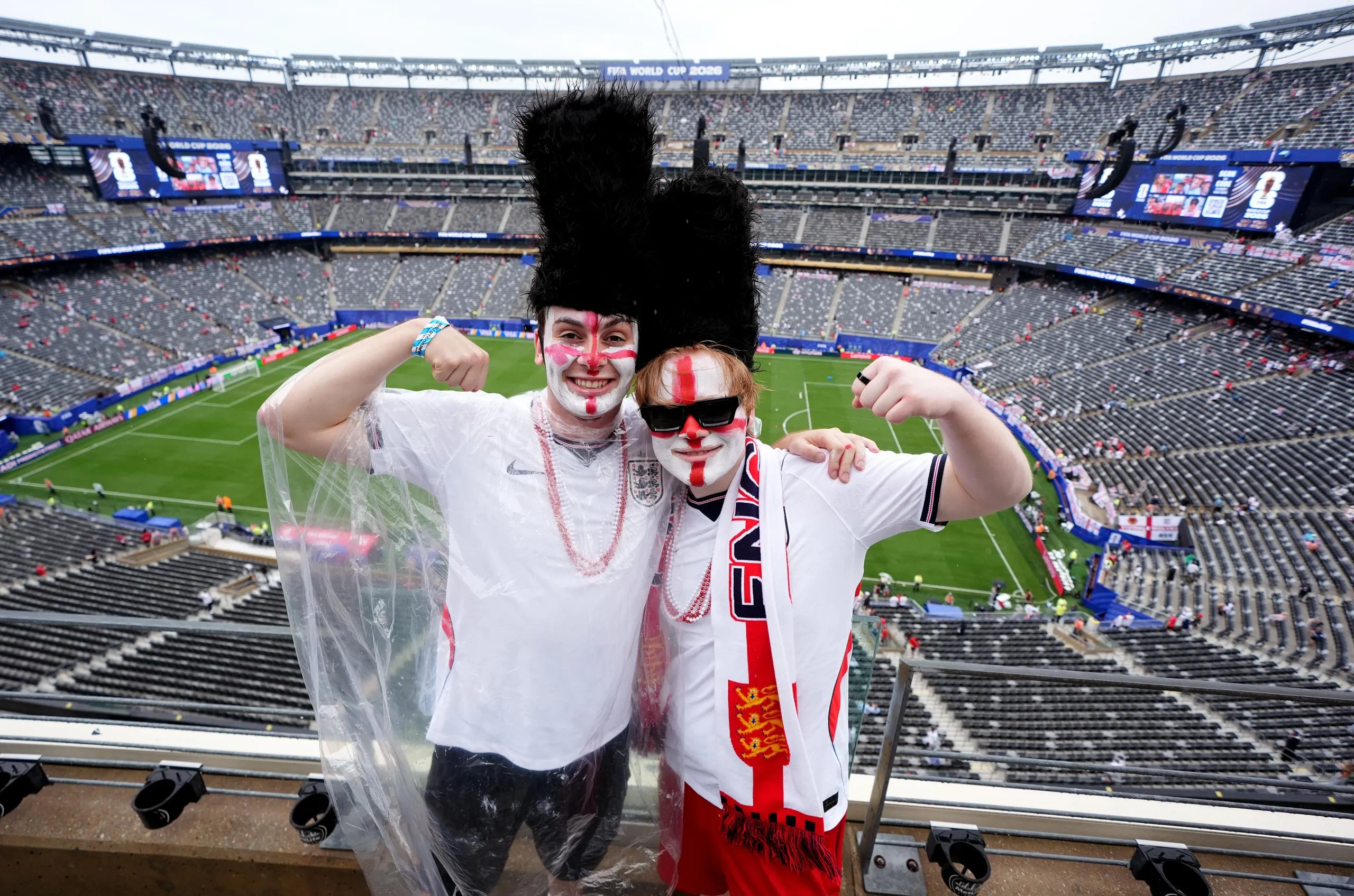 2 fans in busby hats