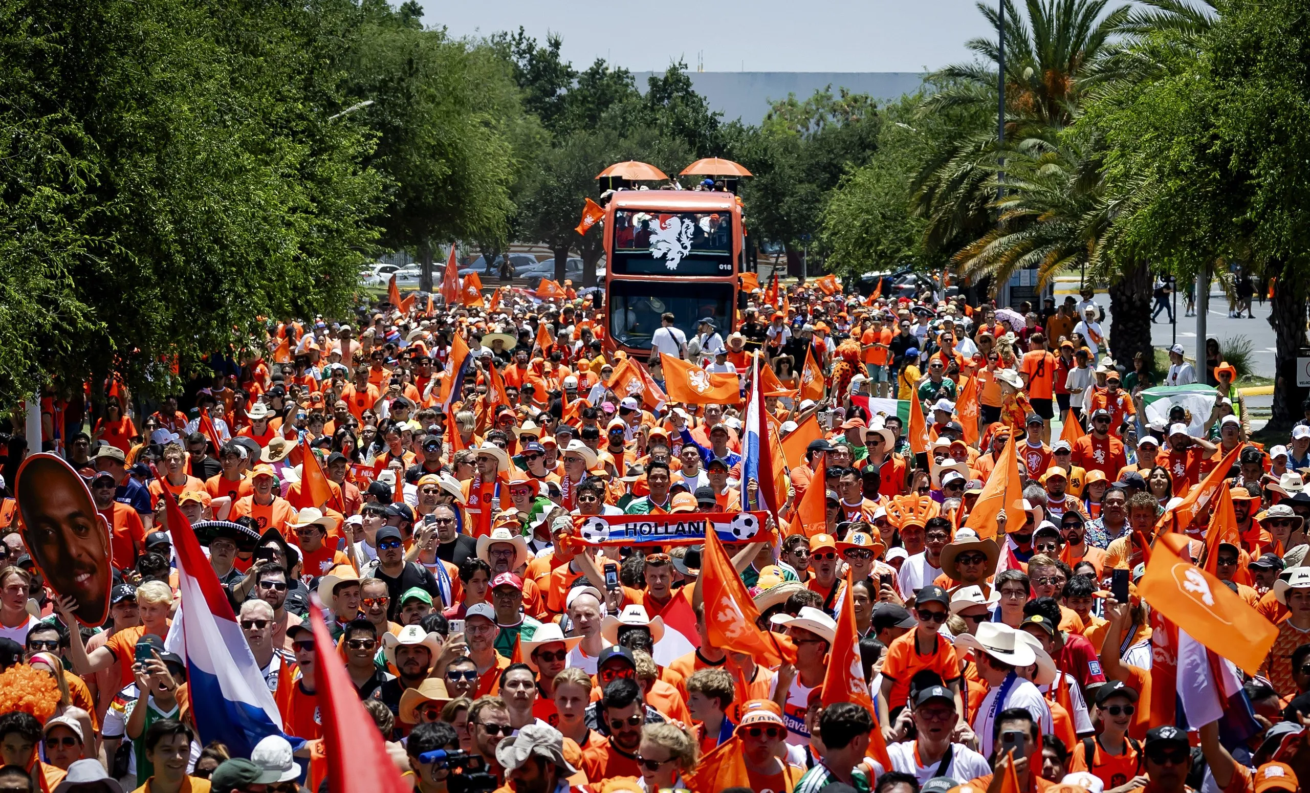 Dutch fans with their orange bus fill the streets of Monterrey.