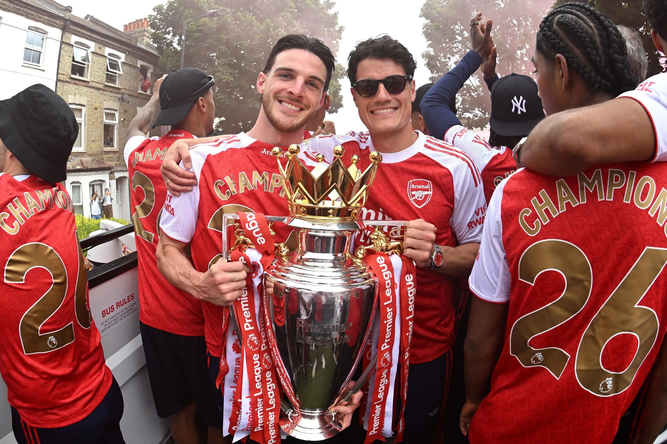 Declan Rice beams alongside Arsenal teammate Christian Nørgaard during Arsenal’s Premier League trophy parade in May