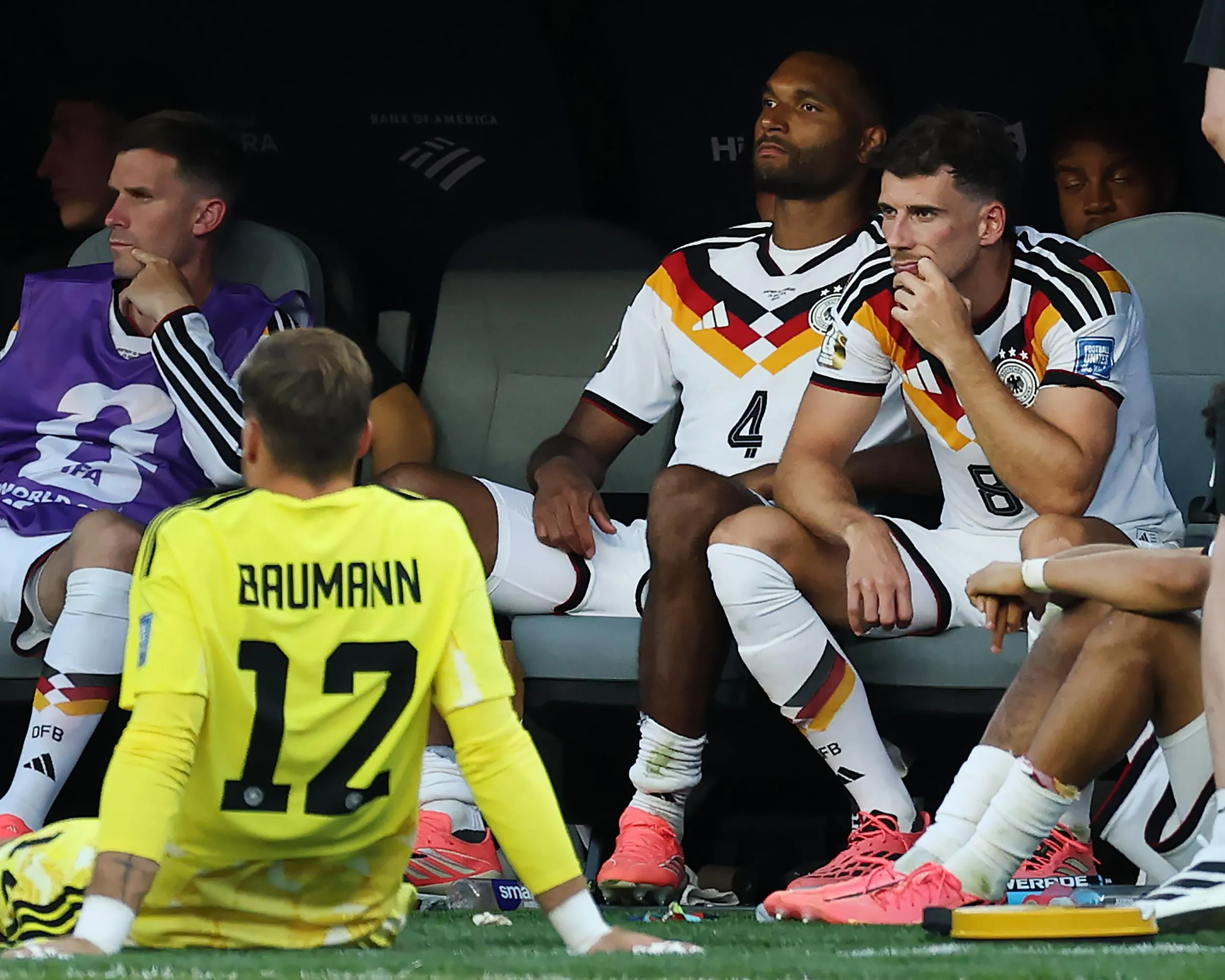 Germany’s players, including Oliver Baumann, Jonathan Tah and Leon Goretzka, sit in the dugout contemplating their loss on Paraguay to penalties in the last 32 of the 2026 World Cup.