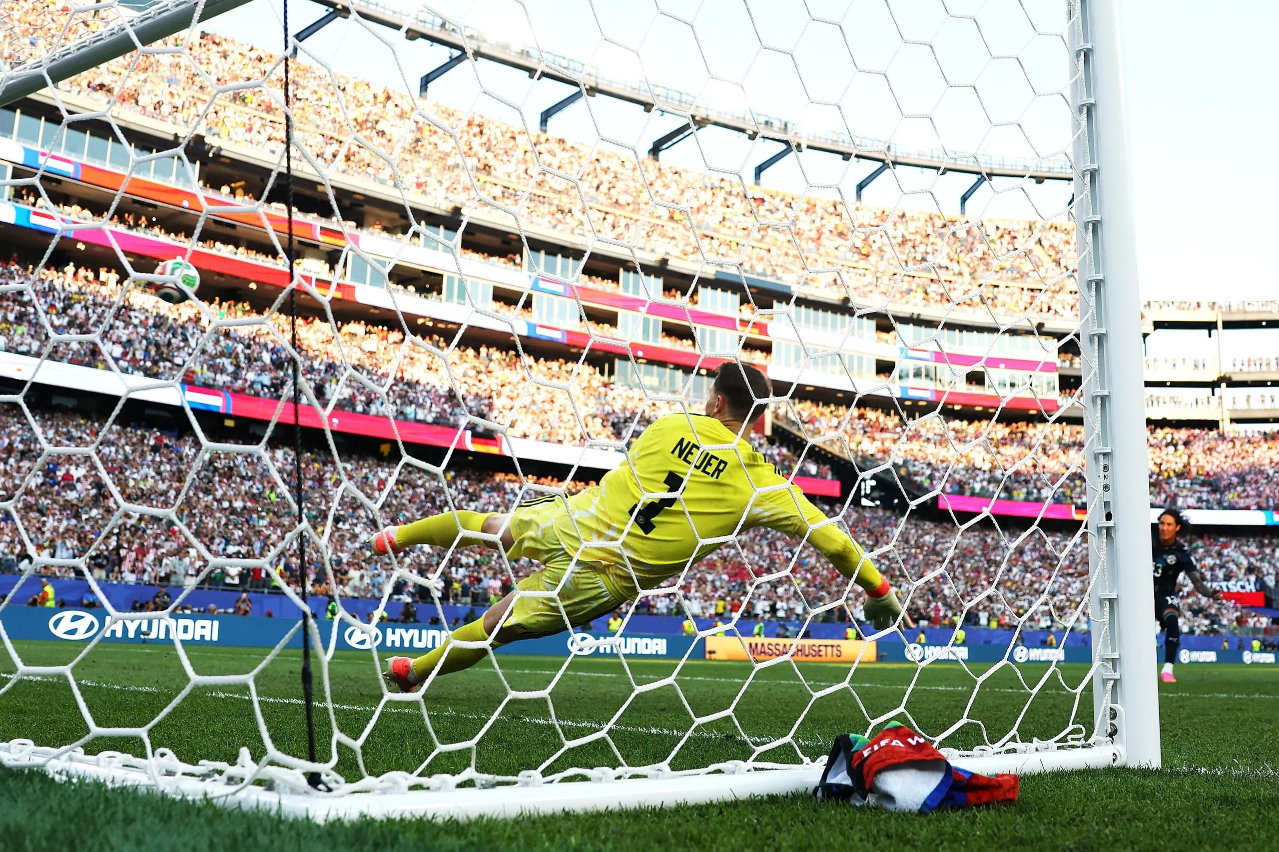 Manuel Neuer watches the winning Paraguay penalty, taken by José Canale, go past him.