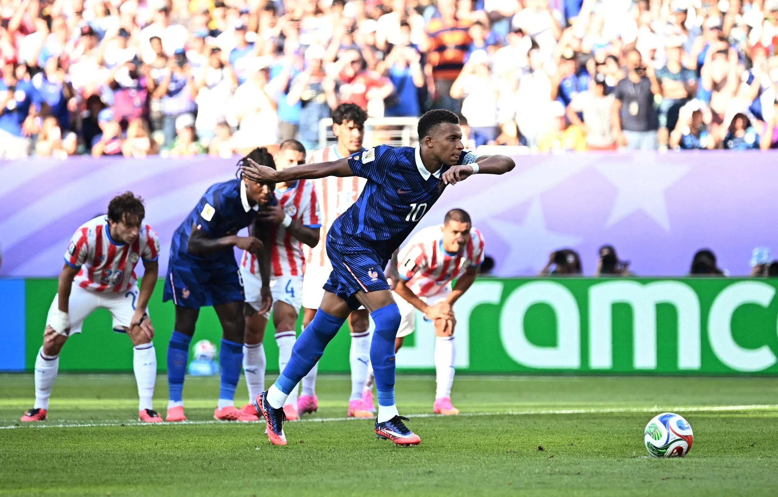 Kylian Mbappé prepares to take the penalty with which France beat Paraguay