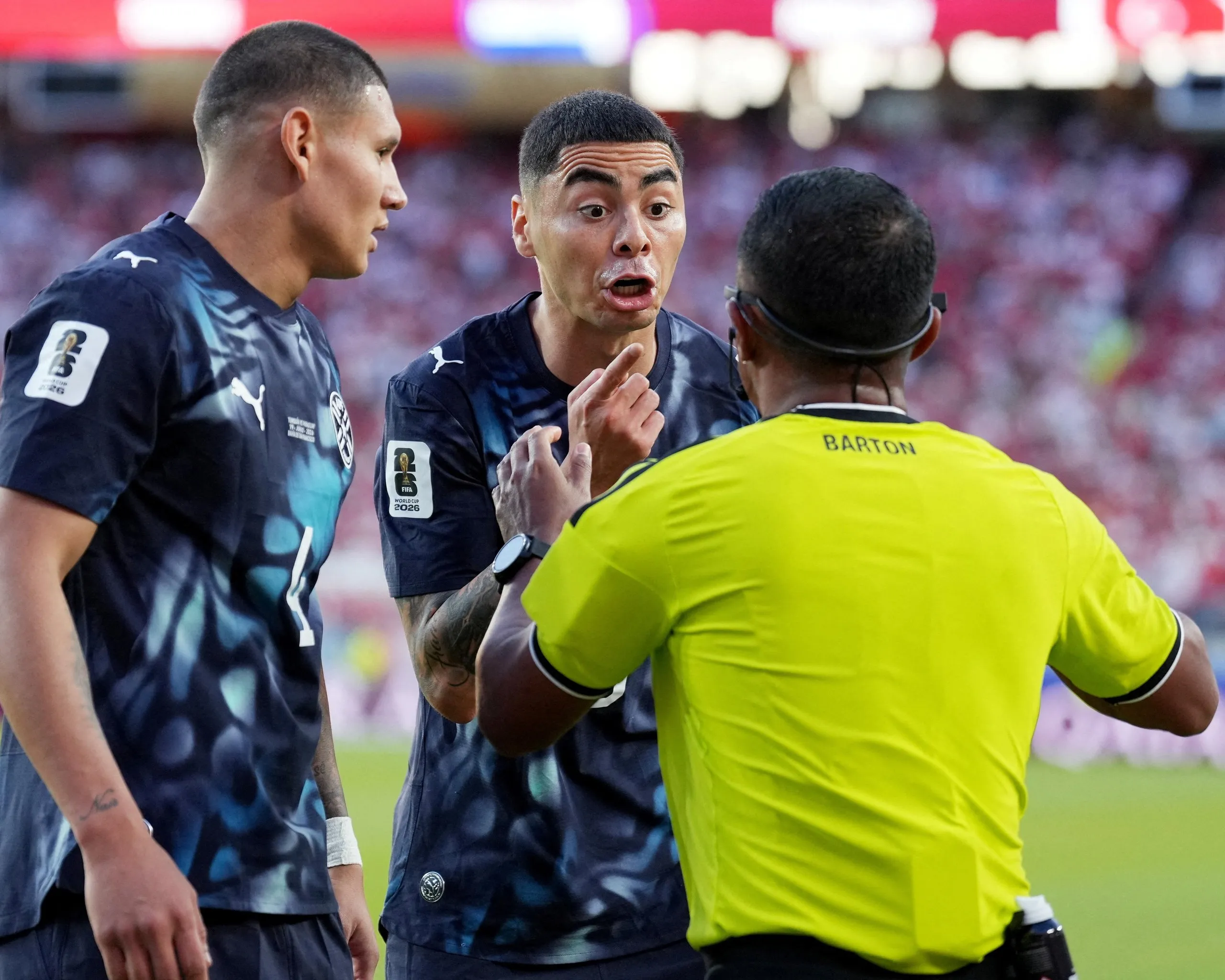 Miguel Almiron argues with referee Ivan Barton