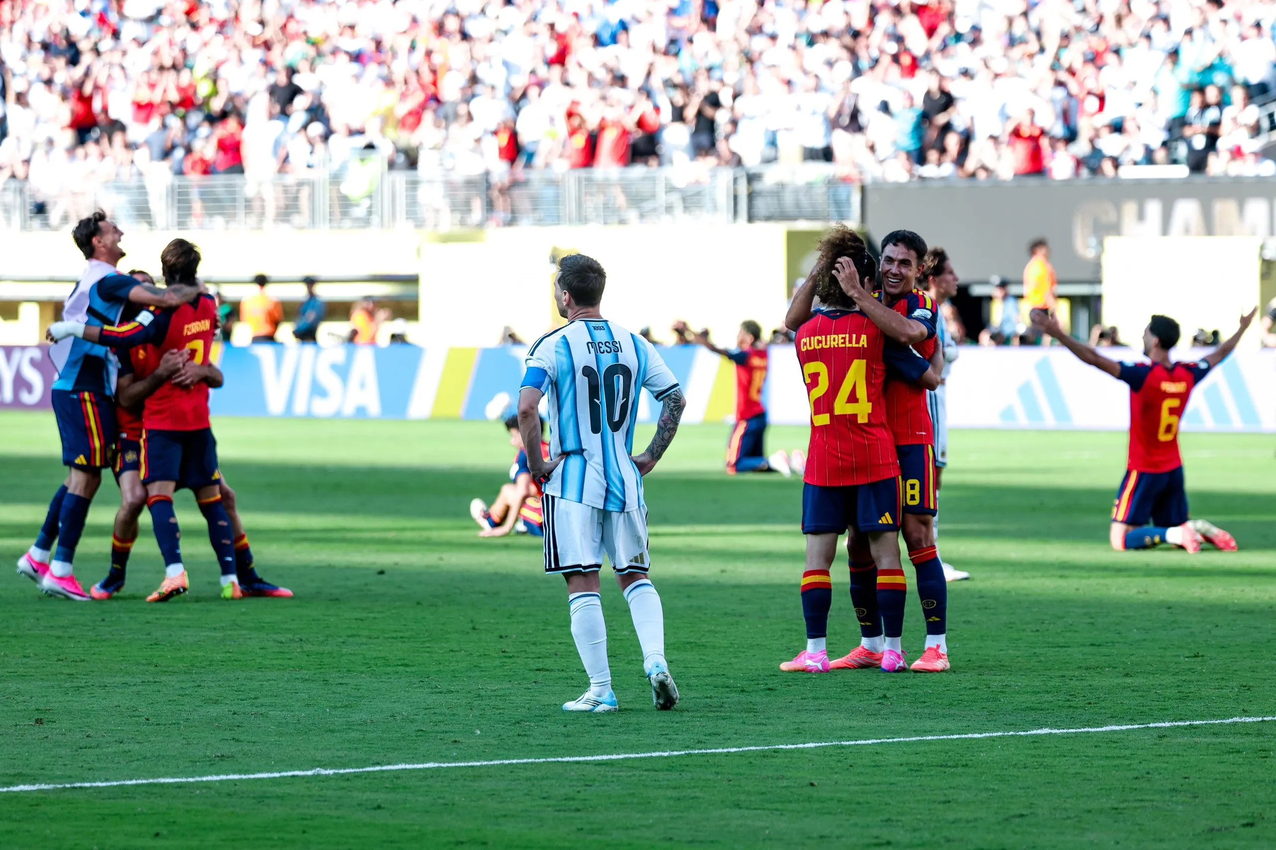 Lionel Messi looks on as Spain celebrate