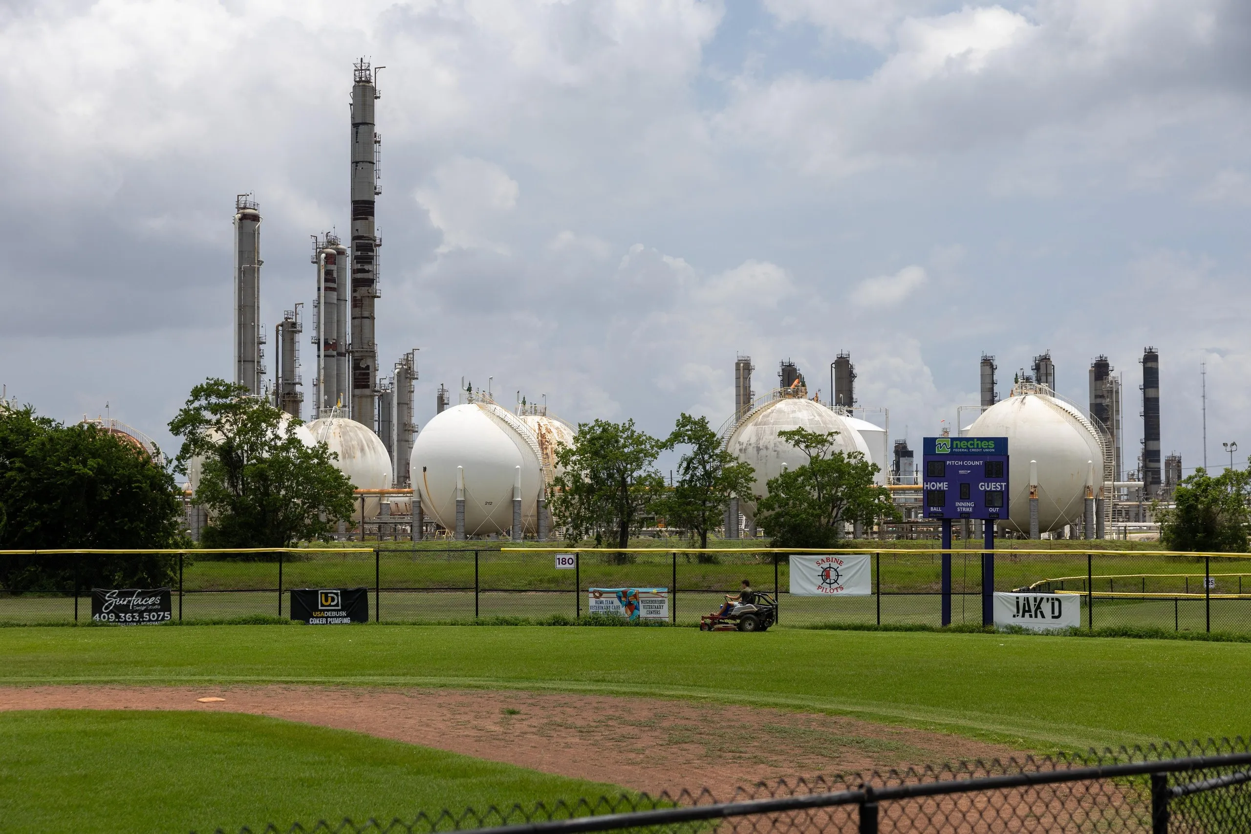 The Total Energies Port Arthur plant next to a little league baseball field.