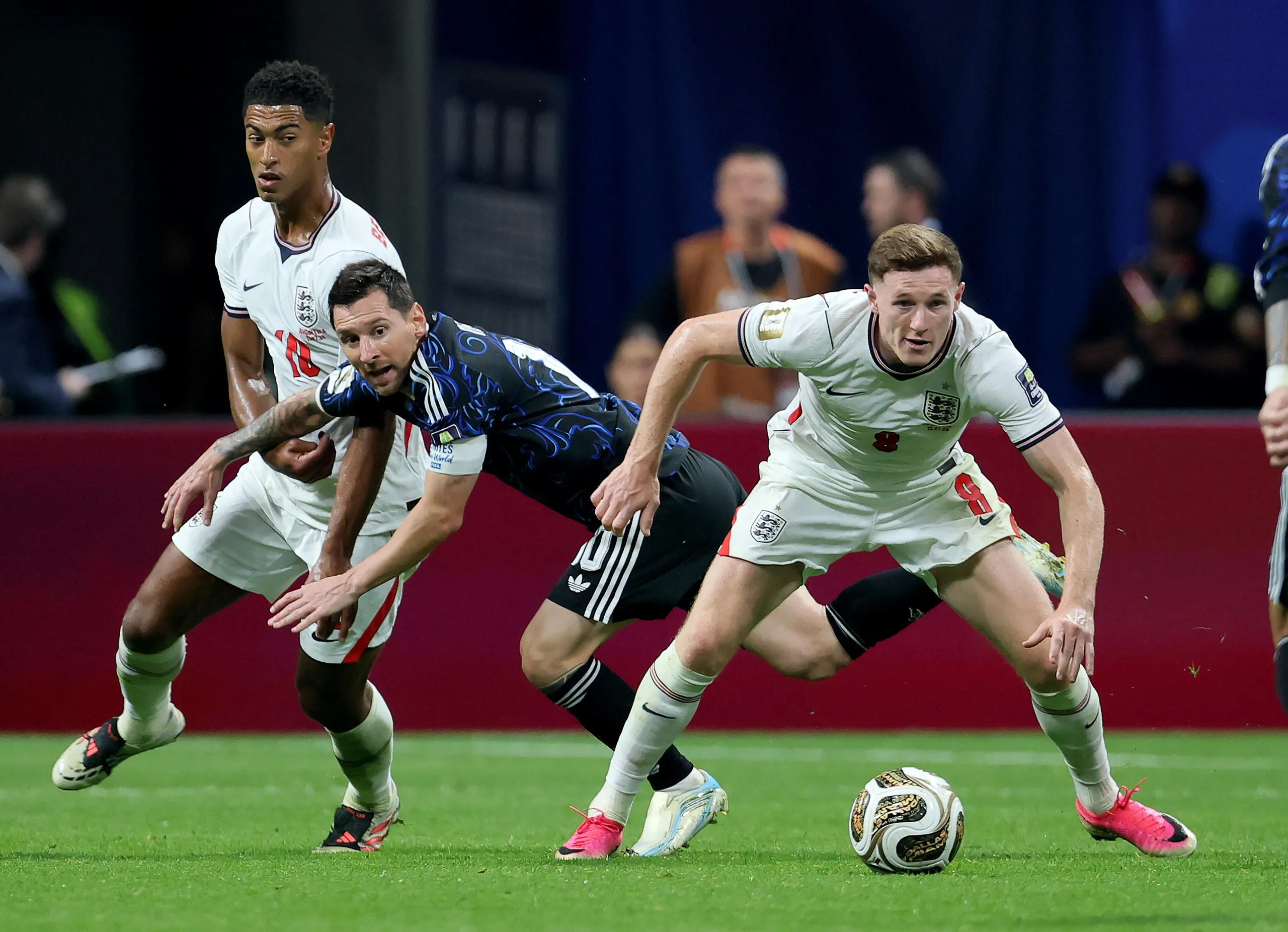 Lionel Messi of Argentina and England’s Elliot Anderson battle for the ball