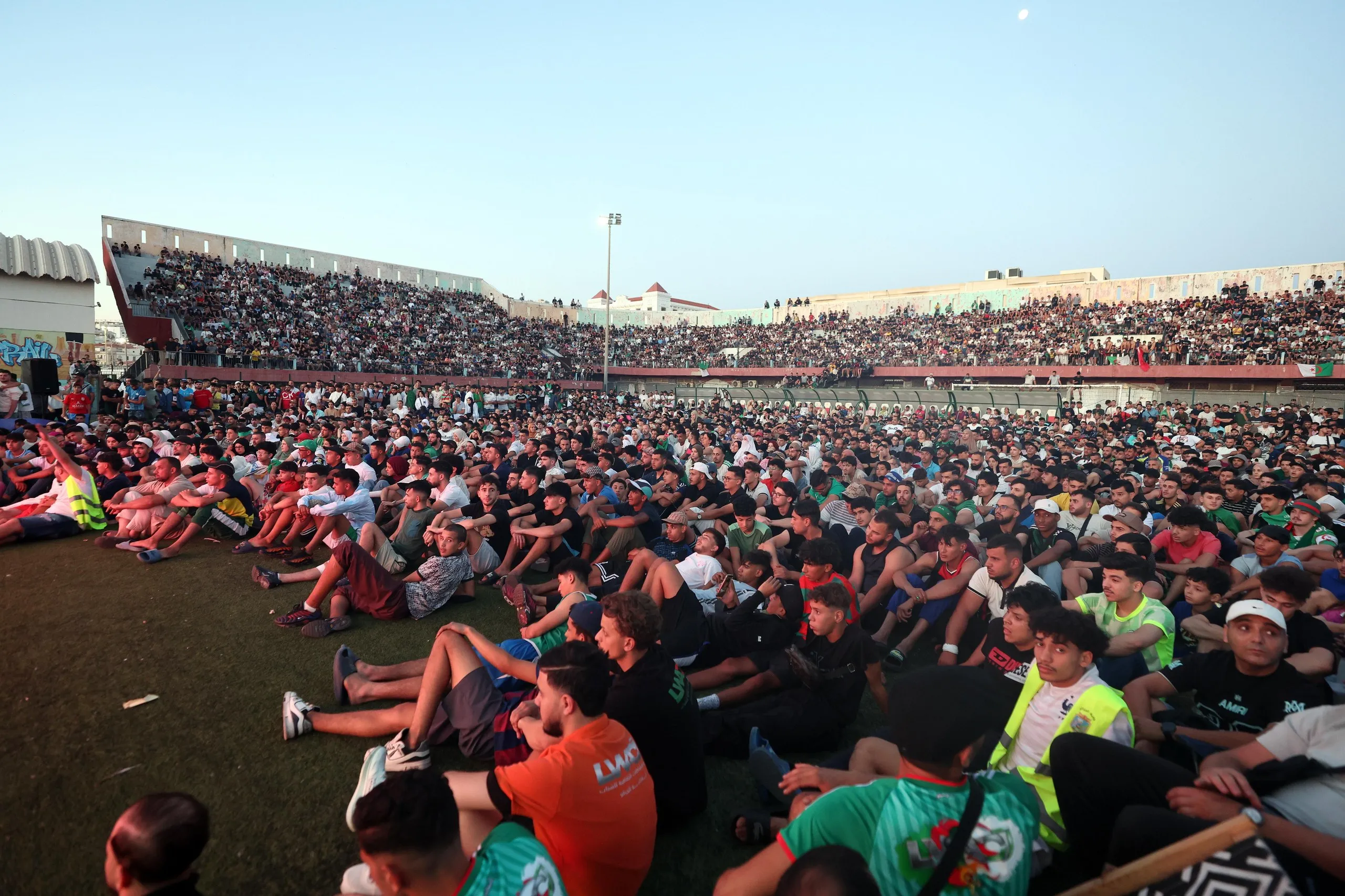 Spectators attend a public viewing at Ferhani Stadium Bab El Ouedin Algiers, Algeria.